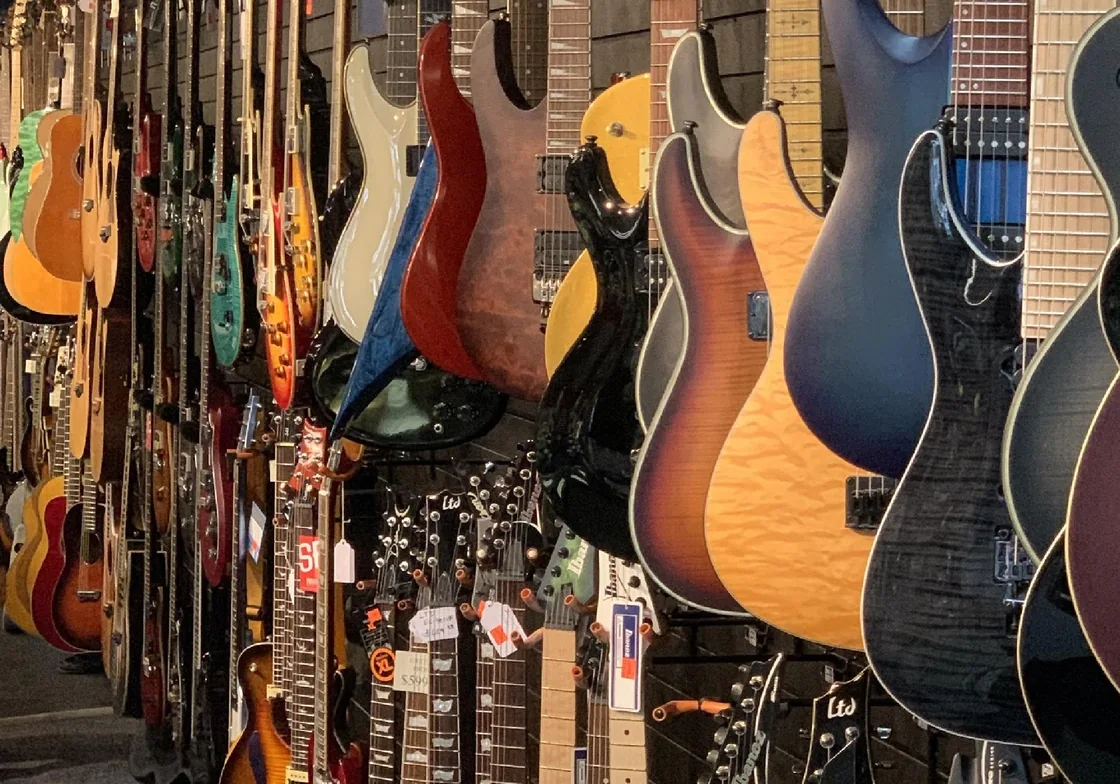 Guitars and other musical instruments displayed in the Edwards retail store